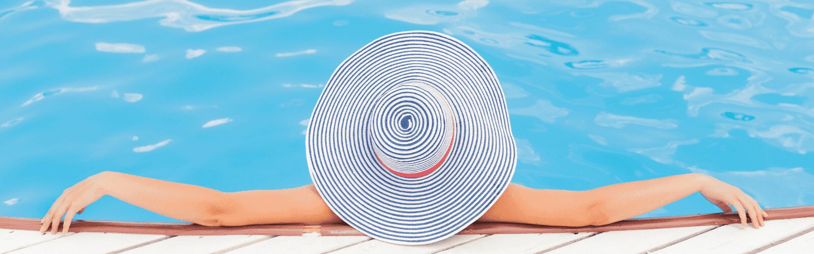 financial adviser fees & advice process - a woman in a blue and white striped hat relaxing in a swimming pool.