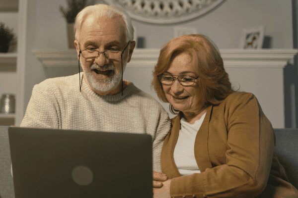 A couple looking at our our financial planning resources and news articles