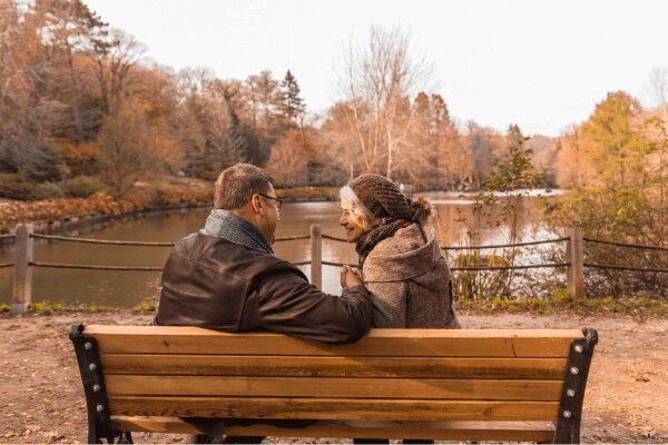 A couple on a bench client stories – early retirement planning with Henson Crisp