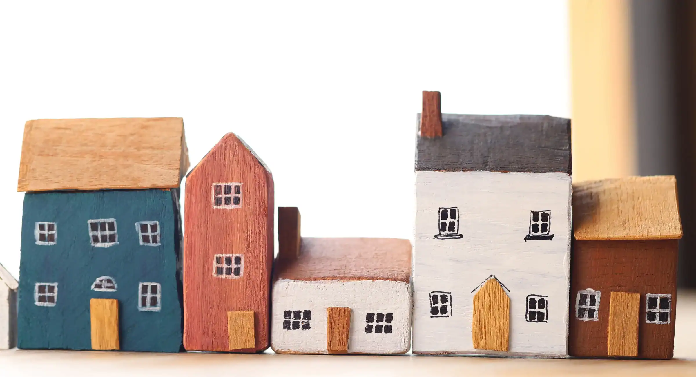 A decorative image of some wooden houses in a row, used for a blog artile about Stamp Duty Land Tax (SDLT)