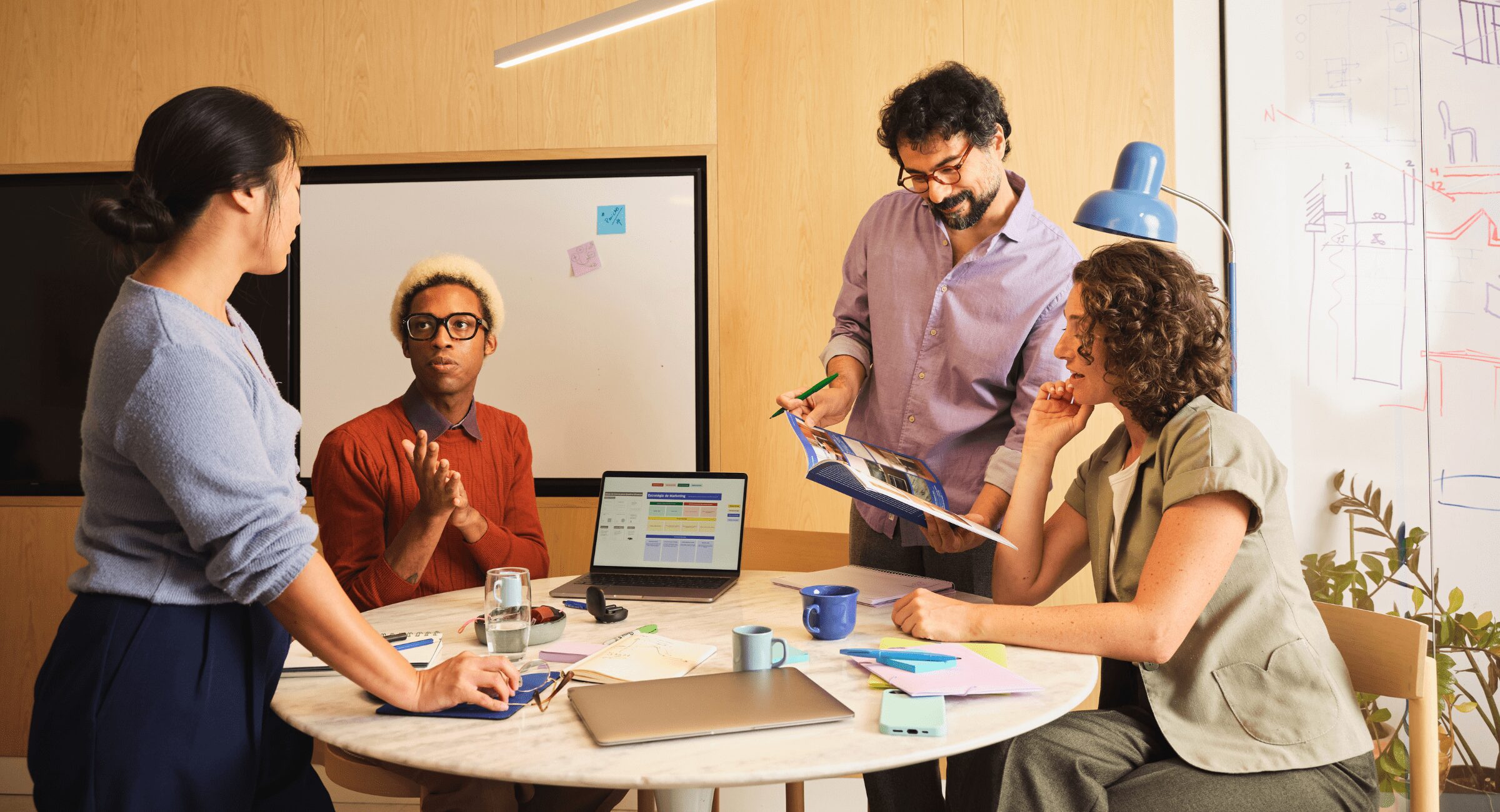 pensions salary sacrifice - image of 4 people around a desk at work
