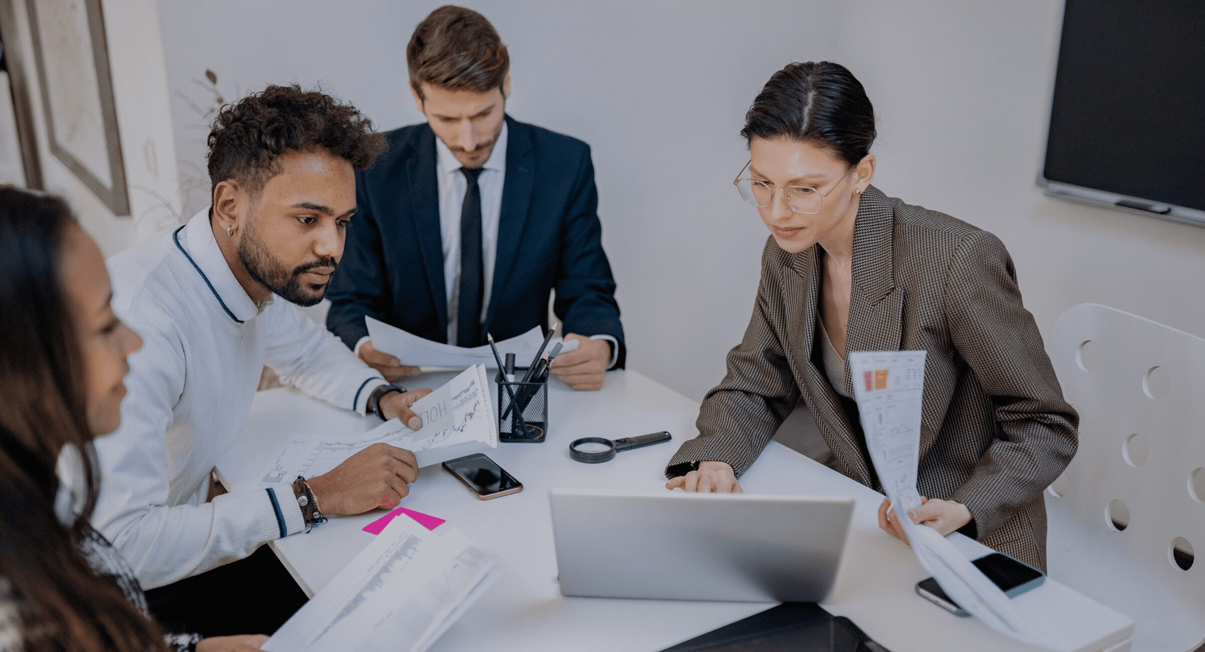 Financial adviser discussing risk tolerance questionnaire with client