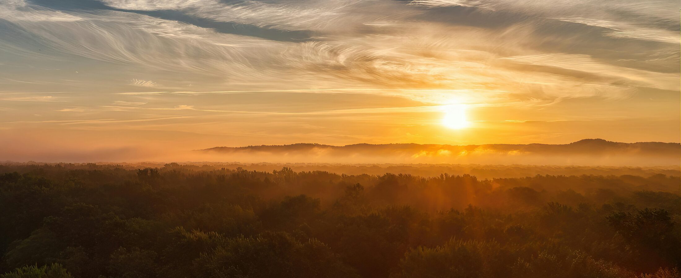 The sun setting over the hills used for our blog about healthy life expectancy