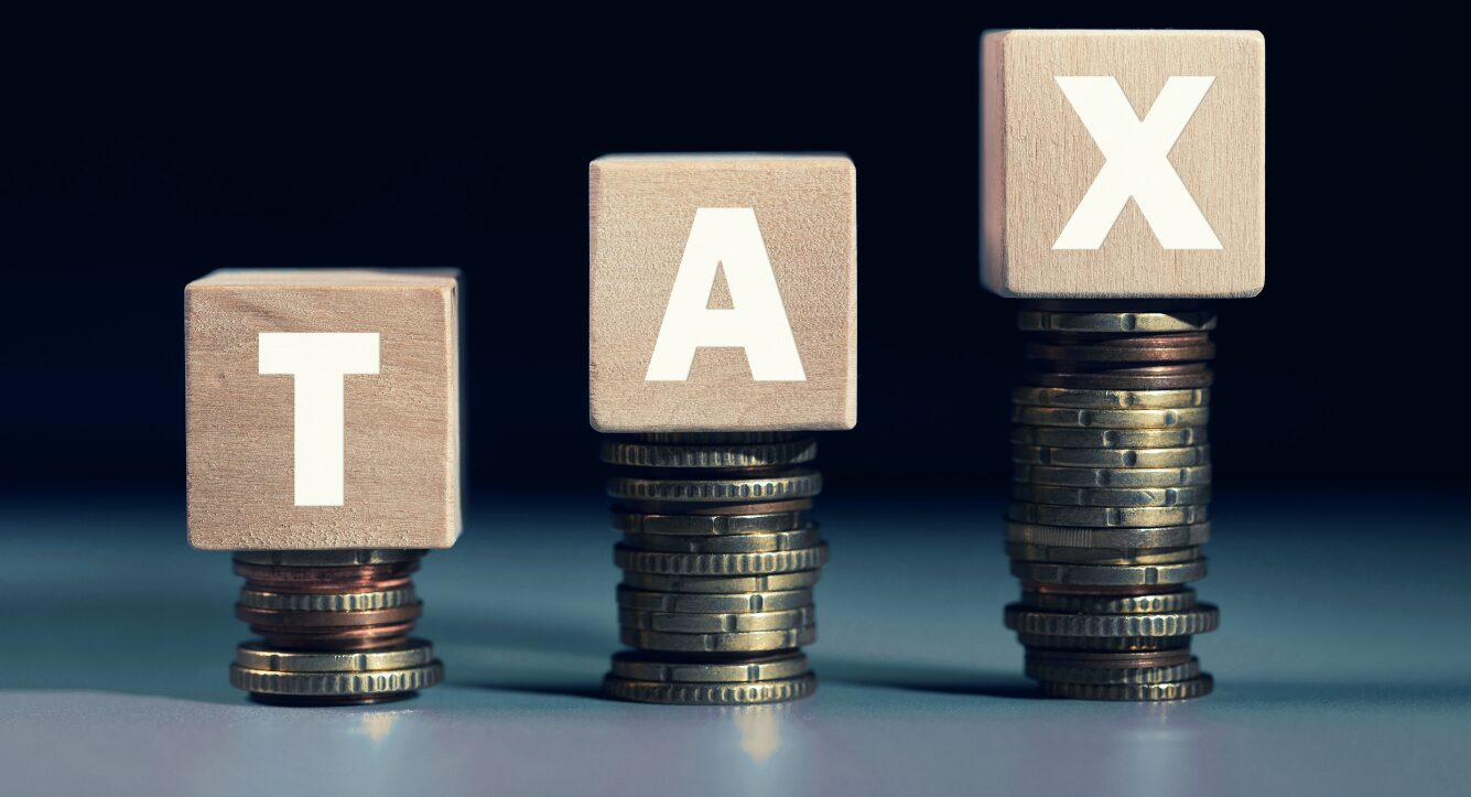 making tax digital - letter blogs spelling out tax balancing on stacks of coins