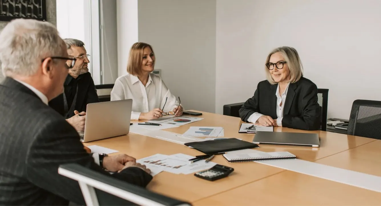 Financial advisers suitability assessment taking place in meeting room with client